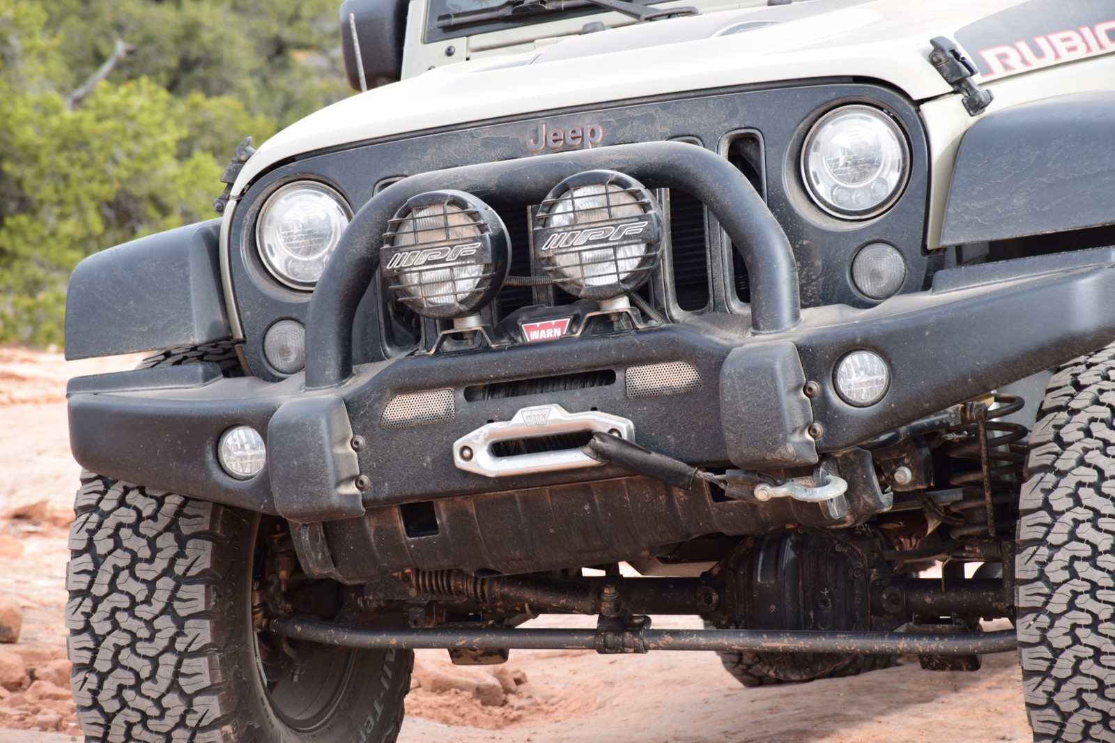 Close view of the AEV bumper, winch and front suspension